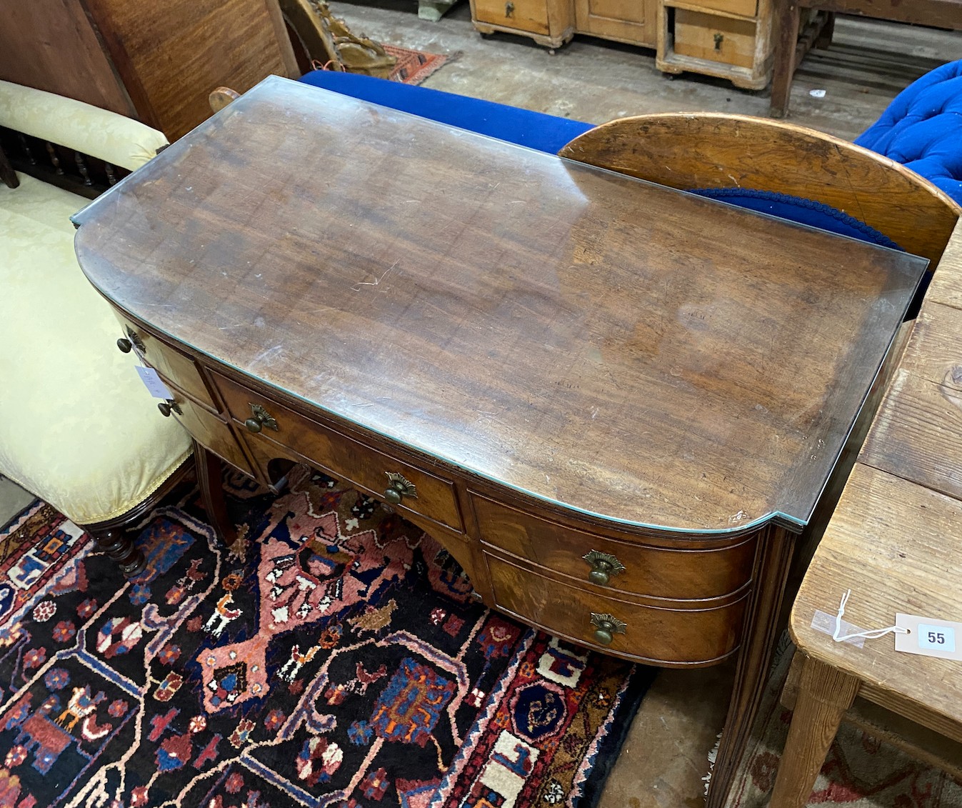 A George III Sheraton period mahogany bow front dressing table, length 112cm, depth 56cm, height 80cm